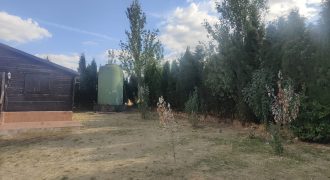 REF 25107- TERRENO CON CASA DE MADERA