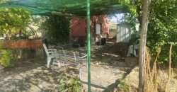 REF 25107- TERRENO CON CASA DE MADERA