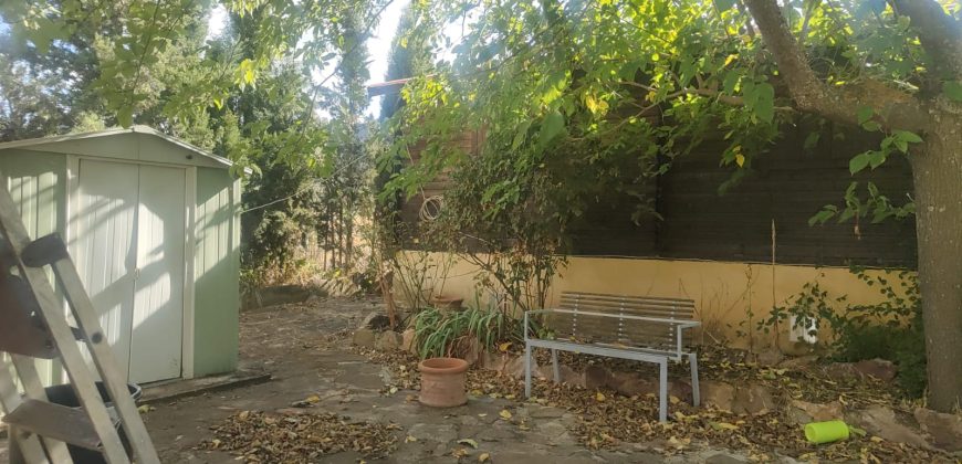 REF 25107- TERRENO CON CASA DE MADERA