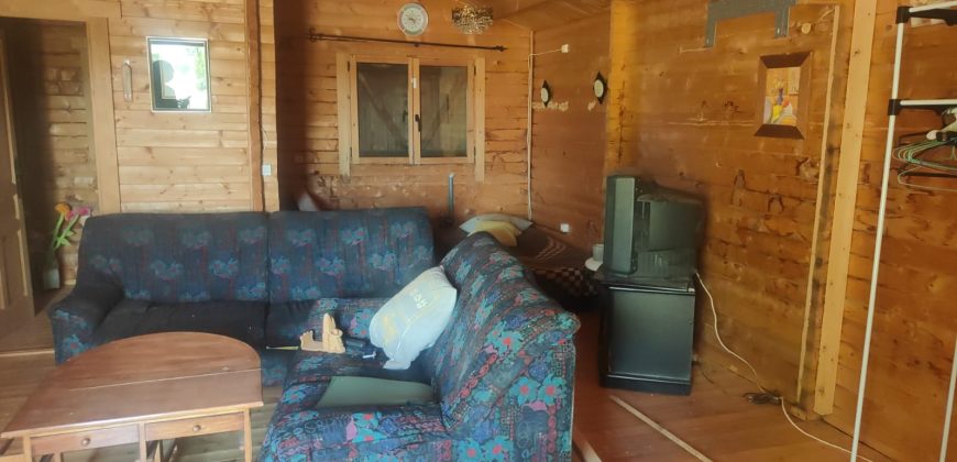 REF 25107- TERRENO CON CASA DE MADERA