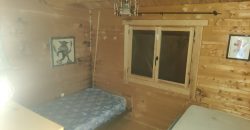 REF 25107- TERRENO CON CASA DE MADERA