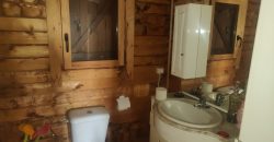 REF 25107- TERRENO CON CASA DE MADERA