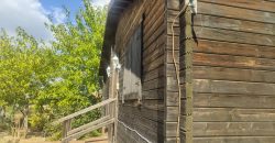 REF 25107- TERRENO CON CASA DE MADERA