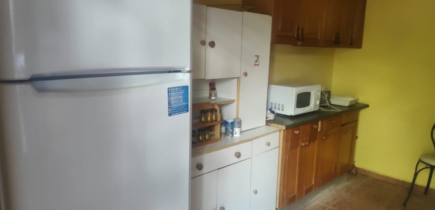 REF 25107- TERRENO CON CASA DE MADERA